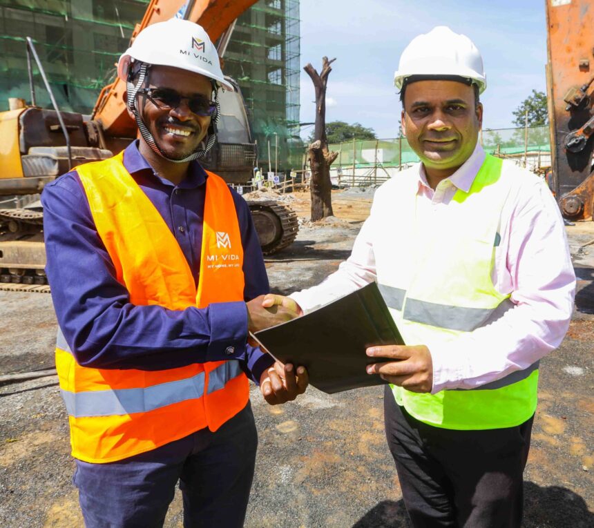 Mi Vida Homes Chief Executive Officer Samuel Kariuki (left) shakes hands with Dharmesh Sanghani, Director Parklane Construction after breaking ground at Garden City as part of the real estate efforts to address housing needs in the country.